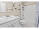 This bathroom is equipped with a vanity sink, toilet, and shower-tub combination, featuring a neutral color scheme at 4150 Horseshoe Rd. # 33, Little River, SC 29566