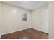 A bedroom featuring hardwood floors, neutral paint, recessed lighting, and a large window at 4150 Horseshoe Rd. # 33, Little River, SC 29566