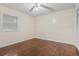 Bedroom with hardwood floors, ceiling fan, and natural light from the window at 4150 Horseshoe Rd. # 33, Little River, SC 29566