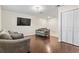 Comfortable living room featuring hardwood floors and closet space at 4150 Horseshoe Rd. # 33, Little River, SC 29566