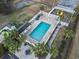 Aerial view of fenced in community pool with nearby playground at 4150 Horseshoe Rd. # 33, Little River, SC 29566