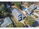 An aerial perspective highlighting the home, including the pool and adjacent structures at 4244 Luck Ave., Little River, SC 29566