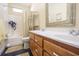 Bathroom with double vanity and decorative mirror at 4244 Luck Ave., Little River, SC 29566