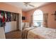 Bedroom features a window, closet, and floral bedding at 4244 Luck Ave., Little River, SC 29566