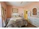 Inviting bedroom offers neutral walls, wood floor and a large dresser at 4244 Luck Ave., Little River, SC 29566