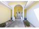 Inviting entryway featuring decorative columns, lion statues, a hanging lantern, and decorative wreath on the door at 4244 Luck Ave., Little River, SC 29566