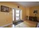 Foyer boasts yellow walls, tile floor and a front door with glass panels at 4244 Luck Ave., Little River, SC 29566