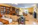 Spacious living room features hardwood floors, comfortable seating, and built-in shelving and cabinetry at 4244 Luck Ave., Little River, SC 29566