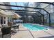 Relaxing pool with a screened enclosure and plenty of seating at 4244 Luck Ave., Little River, SC 29566