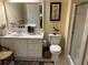 Bright bathroom featuring a white vanity, toilet, and glass-enclosed shower at 4305 Rivergate Ln., Little River, SC 29566