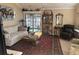 Bright living room featuring a decorative rug, comfortable sofa, and sliding glass doors to the outdoors at 4305 Rivergate Ln., Little River, SC 29566