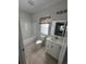 Neutral bathroom featuring tiled floors, tub and shower combo, and vanity at 4340 Grande Harbour Blvd., Little River, SC 29566