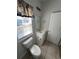 Neutrally decorated bathroom with tiled floor and nautical decor at 4340 Grande Harbour Blvd., Little River, SC 29566