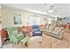 Relaxing living room with ceiling fan, comfortable seating, and lots of natural light creating a welcoming atmosphere at 4350 Intercoastal Dr. # 1101, Little River, SC 29566