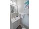 Bright bathroom with white vanity, framed mirror and fresh towels at 4406 N Ocean Blvd. # B-2, North Myrtle Beach, SC 29582