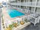 View of the King's View Villas pool area with chairs, landscaping, and fencing at 4406 N Ocean Blvd. # B-2, North Myrtle Beach, SC 29582