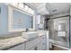 Modern bathroom featuring a vessel sink, granite counters, and glass enclosed tiled shower at 4601 N Ocean Blvd. # 203, North Myrtle Beach, SC 29582