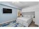 Bright bedroom featuring a built-in bunk bed, TV, and colorful fish rug at 4601 N Ocean Blvd. # 203, North Myrtle Beach, SC 29582