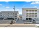 Exterior of condo buildings featuring private balconies, easy beach access, and convenient parking at 4601 N Ocean Blvd. # 203, North Myrtle Beach, SC 29582