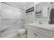 Well-lit bathroom featuring a glass-enclosed shower and white vanity at 4801 N Ocean Blvd. # 3E, North Myrtle Beach, SC 29582