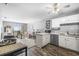 Cozy living room with an open floor plan, leading to a well-equipped kitchen and bright sliding glass doors to balcony at 4801 N Ocean Blvd. # 3E, North Myrtle Beach, SC 29582