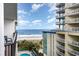 Balcony view overlooking the ocean, beach, and a community pool at the condo complex at 5308 N Ocean Blvd. # 714, Myrtle Beach, SC 29577