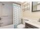 Bright bathroom featuring a shower-tub combo, vanity with sink, and towel rack, perfect for a relaxing experience at 5308 N Ocean Blvd. # 714, Myrtle Beach, SC 29577