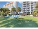 Lawn area with lounge chairs and green grass with a view of the beautiful condominiums in the distance at 5308 N Ocean Blvd. # 714, Myrtle Beach, SC 29577