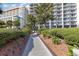 Attractive walkway with manicured bushes and shrubbery with a view of the condos at 5308 N Ocean Blvd. # 714, Myrtle Beach, SC 29577