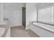 Bathroom featuring a soaking tub, glass shower, and vanity with a stone countertop at 534 South Creekside Dr., Murrells Inlet, SC 29576