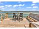 Relaxing waterfront dock with seating, a peaceful river view, and clear blue skies at 534 South Creekside Dr., Murrells Inlet, SC 29576