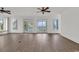 Elegant living room with wood floors, balcony access, and marsh views at 534 South Creekside Dr., Murrells Inlet, SC 29576