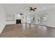 Bright and airy living room with hardwood floors, a fireplace, and access to the balcony at 534 South Creekside Dr., Murrells Inlet, SC 29576