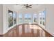 Sunlit living room boasts scenic water views through large windows and sliding glass doors at 534 South Creekside Dr., Murrells Inlet, SC 29576