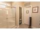 Modern bathroom with a glass-enclosed shower, tiled floor, and white trim at 537 Botany Loop # 537, Murrells Inlet, SC 29576