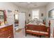 Cozy bedroom featuring a wood bed frame, dresser, and a bright window at 537 Botany Loop # 537, Murrells Inlet, SC 29576