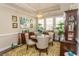 Elegant dining room featuring a decorative chandelier, floral rug, and tray ceiling at 537 Botany Loop # 537, Murrells Inlet, SC 29576