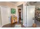 Hallway with hardwood floors, storage, and decorative accents, creating a warm and inviting atmosphere at 537 Botany Loop # 537, Murrells Inlet, SC 29576