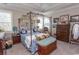 Main bedroom showcasing four-poster bed, dresser, and decor at 537 Botany Loop # 537, Murrells Inlet, SC 29576