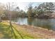 Peaceful waterfront view with a serene pond, lush greenery, and mature trees at 537 Botany Loop # 537, Murrells Inlet, SC 29576