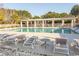 Community pool with lounge chairs, tables, and a covered pavilion at 537 Botany Loop # 537, Murrells Inlet, SC 29576