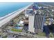 Beautiful aerial shot of a beachside condo and nearby pool, offering stunning ocean views and convenient parking at 5523 N Ocean Blvd. # 1506, Myrtle Beach, SC 29577