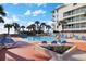 Inviting outdoor pool area with lounge chairs and palm trees under a bright blue sky, perfect for relaxation at 5523 N Ocean Blvd. # 1506, Myrtle Beach, SC 29577