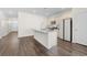 Kitchen with island and stainless steel appliances, including a refrigerator, microwave and stove at 591 Meadowgrass Ct., Myrtle Beach, SC 29588