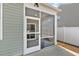 Screened-in back porch with ceiling fan and concrete flooring at 591 Meadowgrass Ct., Myrtle Beach, SC 29588