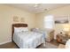 Well-lit bedroom features twin beds, carpeted floor, ceiling fan, and nautical decor at 601 Hillside Dr. N # 1731, North Myrtle Beach, SC 29582