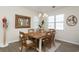 Cozy dining room with a modern chandelier and a wooden table set for six at 601 Hillside Dr. N # 1731, North Myrtle Beach, SC 29582