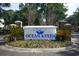 Community sign 'Ocean Keyes' surrounded by flowers and brick pillars at 601 Hillside Dr. N # 1731, North Myrtle Beach, SC 29582