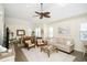 Open concept living room with dining area, featuring wicker chairs, and neutral decor at 601 Hillside Dr. N # 1731, North Myrtle Beach, SC 29582