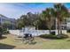 Community pool area featuring a BBQ grill and picnic table for outdoor enjoyment at 601 Hillside Dr. N # 1731, North Myrtle Beach, SC 29582